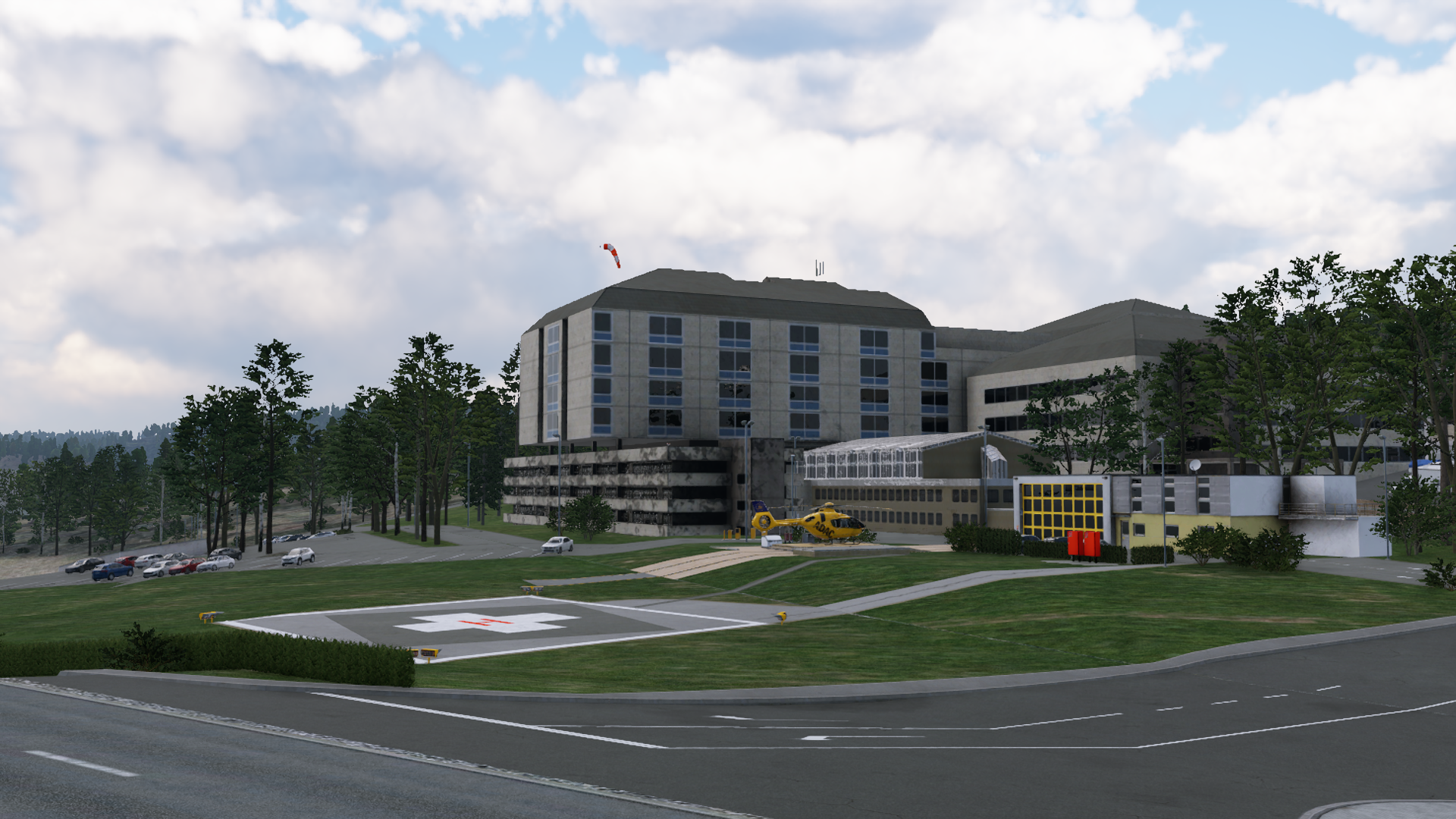 Der Screenshot zeigt einen Blick von der Straße über die Station bis zu dem Komplex des Wittlicher Krankenhauses
